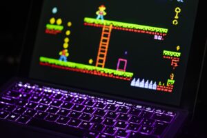 A gaming laptop on a desk displaying a digital storefront interface