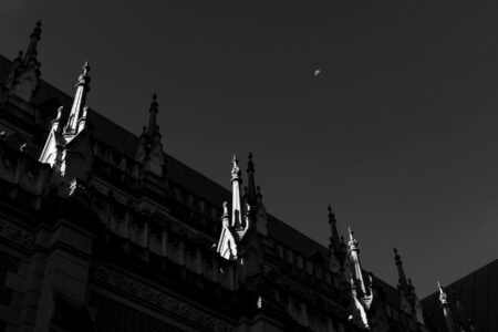 Dark gothic stone architecture evoking the aesthetic of Bloodborne's Victorian horror setting