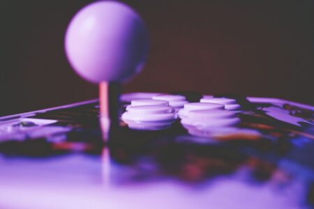 Close-up of a game controller resting on a flat desk surface