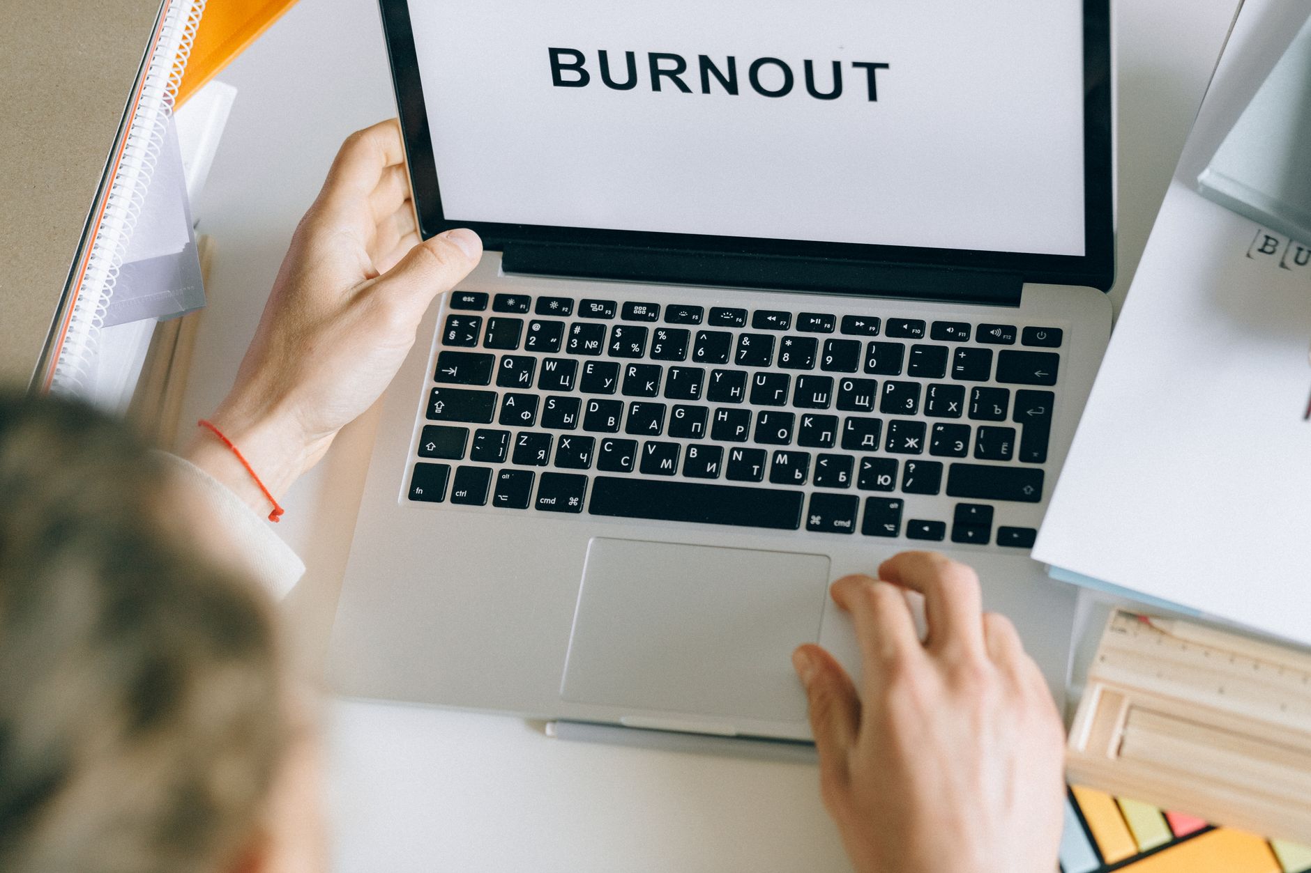 Person sitting at a computer screen looking frustrated while browsing online