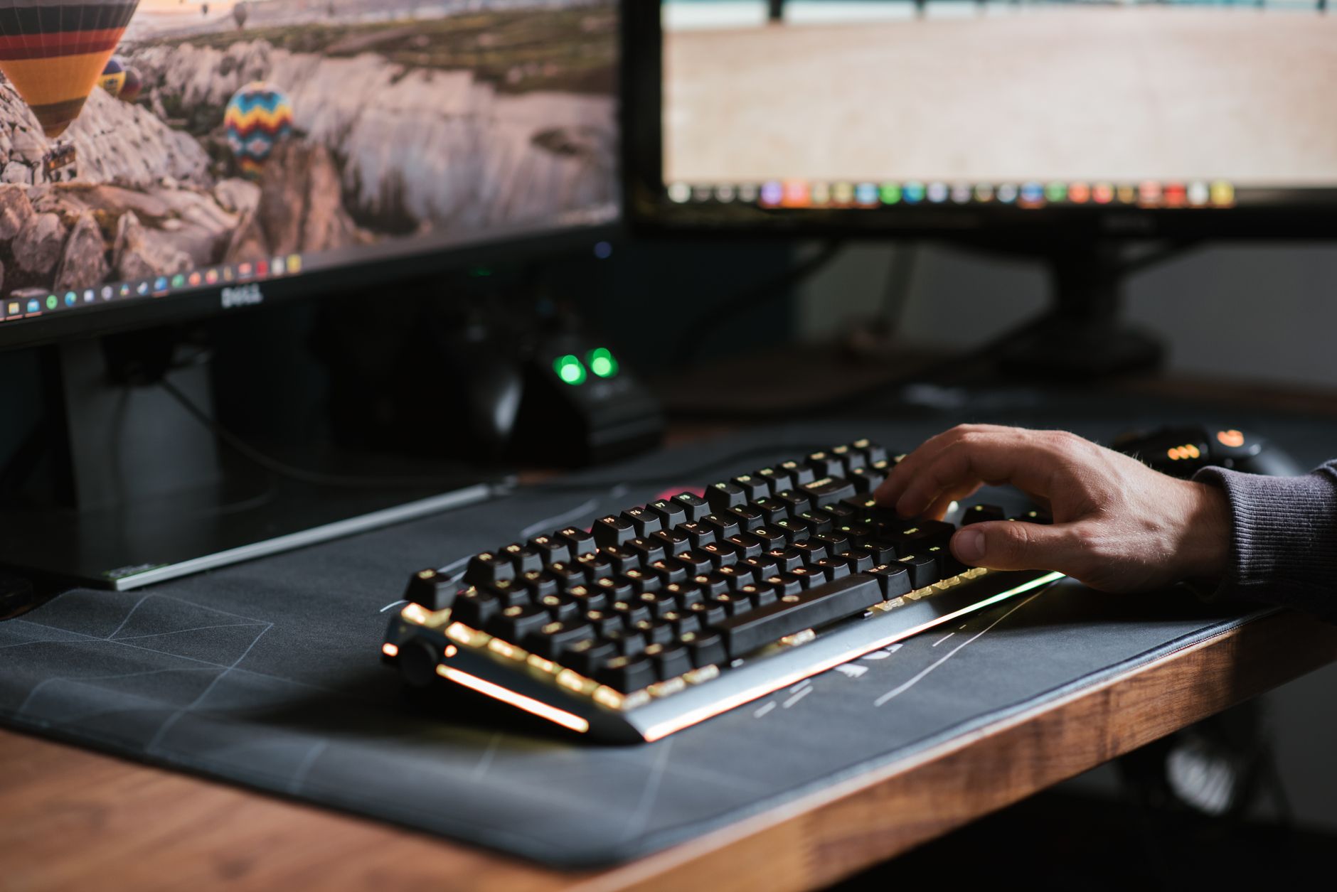 A game development studio workspace with monitors and design materials, representing the creative process behind video game production