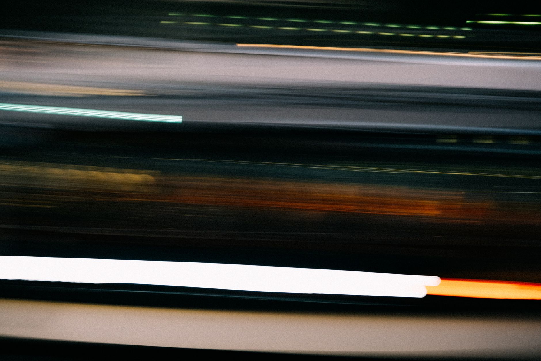 Neon light trails suggesting extreme speed and futuristic motion