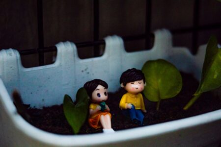 Tiny garden scene with small plants and soil, evoking the miniature world of Pikmin