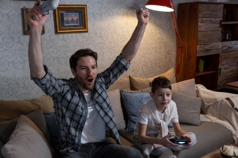Donkey Kong Bananza’s Lack of Two-Player Co-Op Is Quietly Frustrating Parents Two children playing a video game together on a couch with controllers in hand