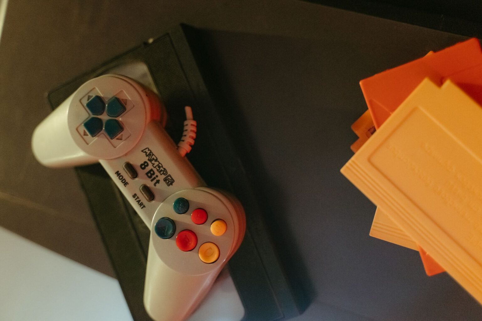 Donkey Kong Bananza’s Funky Kong Snub Is Frustrating Legacy Fans A classic gaming controller resting on a wooden surface, representing retro Nintendo gaming nostalgia