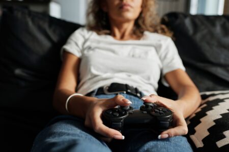 A gaming controller resting on a desk, symbolizing anticipation and waiting for new content