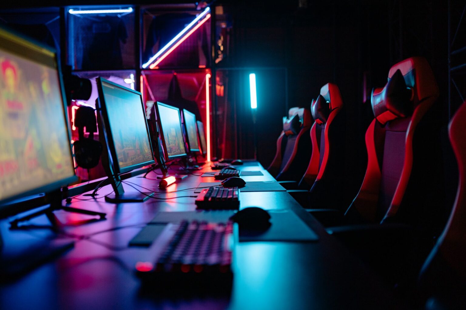 A gaming setup with a screen displaying colorful game environments, representing content creation for video games