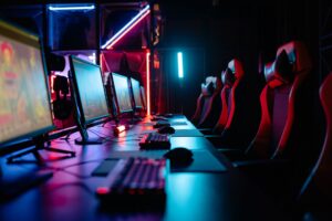 A gaming setup with a screen displaying colorful game environments, representing content creation for video games