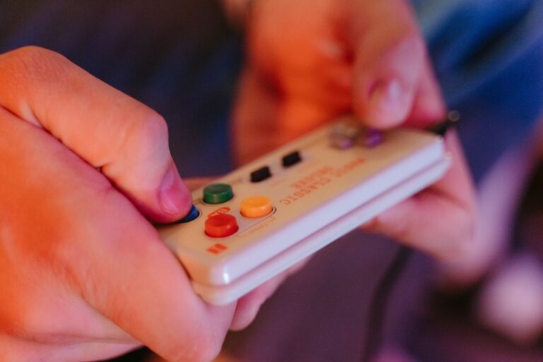 Close-up of a vintage video game controller resting on a flat surface, evoking classic console gaming nostalgia