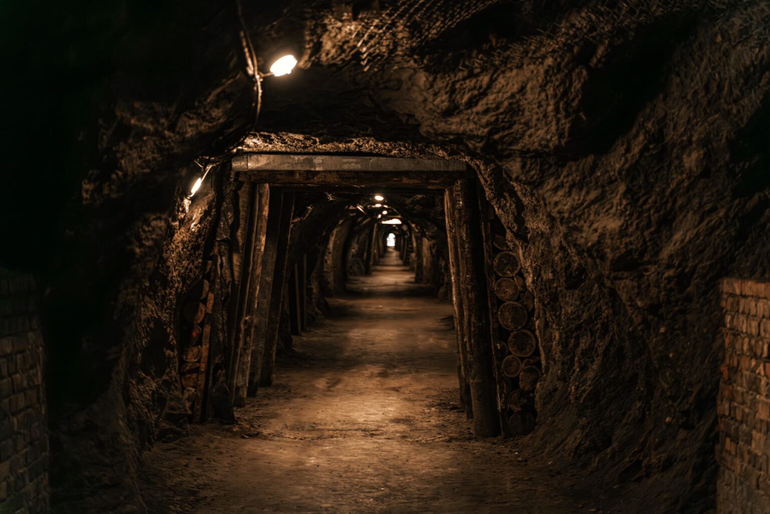 Dark underground cave environment with rocky walls, resembling a mining setting