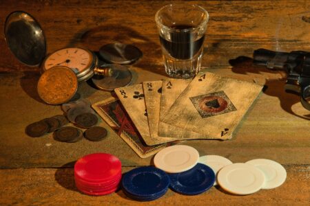 Scattered gold coins on a dark surface evoking classic video game collectibles