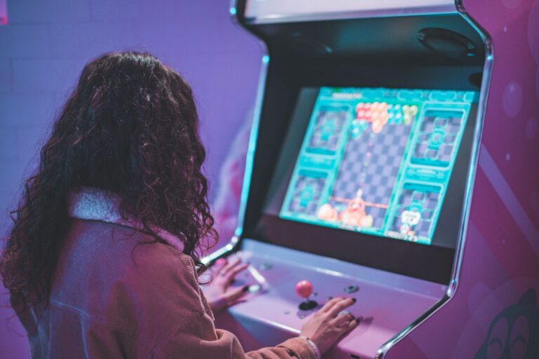 Donkey Kong Bananza’s Absent DK Arcade Nods Are Quietly Stinging Origin Fans A classic upright arcade cabinet glowing in a dark room, representing the original Donkey Kong era
