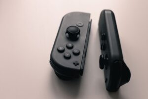 Donkey Kong Bananza’s Absent Funky Kong Playable Slot Is Dividing Fans A gaming controller resting on a surface, representing player choices and game mechanics