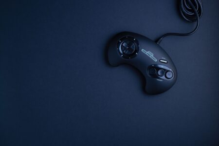 Donkey Kong Bananza’s Absent Expresso the Ostrich Is Alienating DKC Fans A retro gaming controller resting on a surface, evoking classic console gaming nostalgia