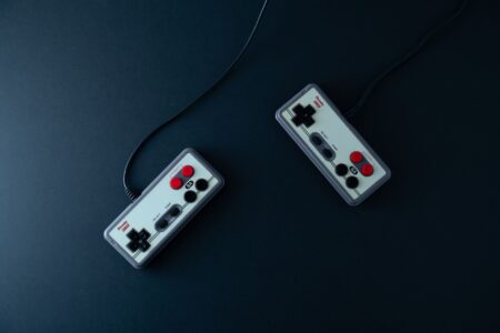 A vintage gaming controller resting on a surface, evoking classic console gaming nostalgia