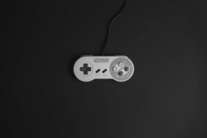 A retro video game controller resting on a flat surface, evoking classic gaming nostalgia