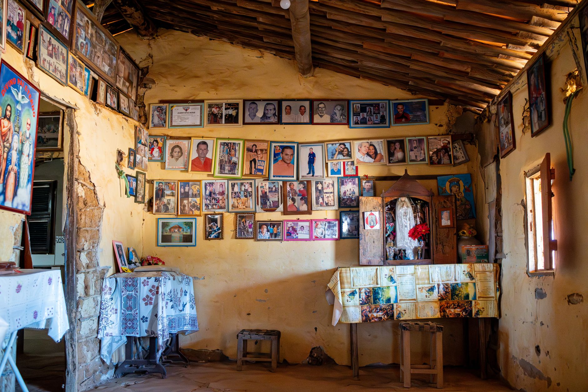 A wall displaying framed family portraits, symbolizing the Kongs gallery concept in Donkey Kong games