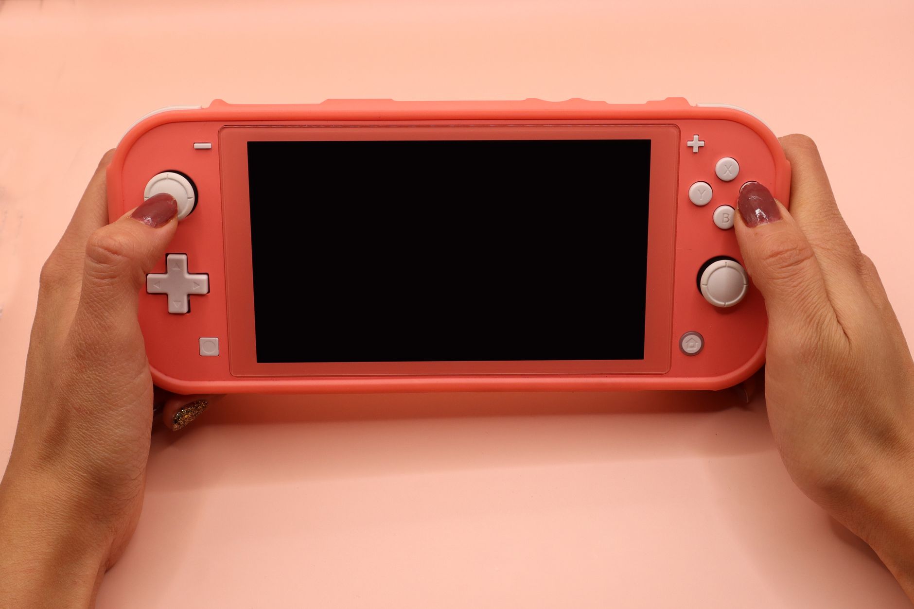 Person playing Nintendo Switch, representing Donkey Kong Bananza players on Switch 2
