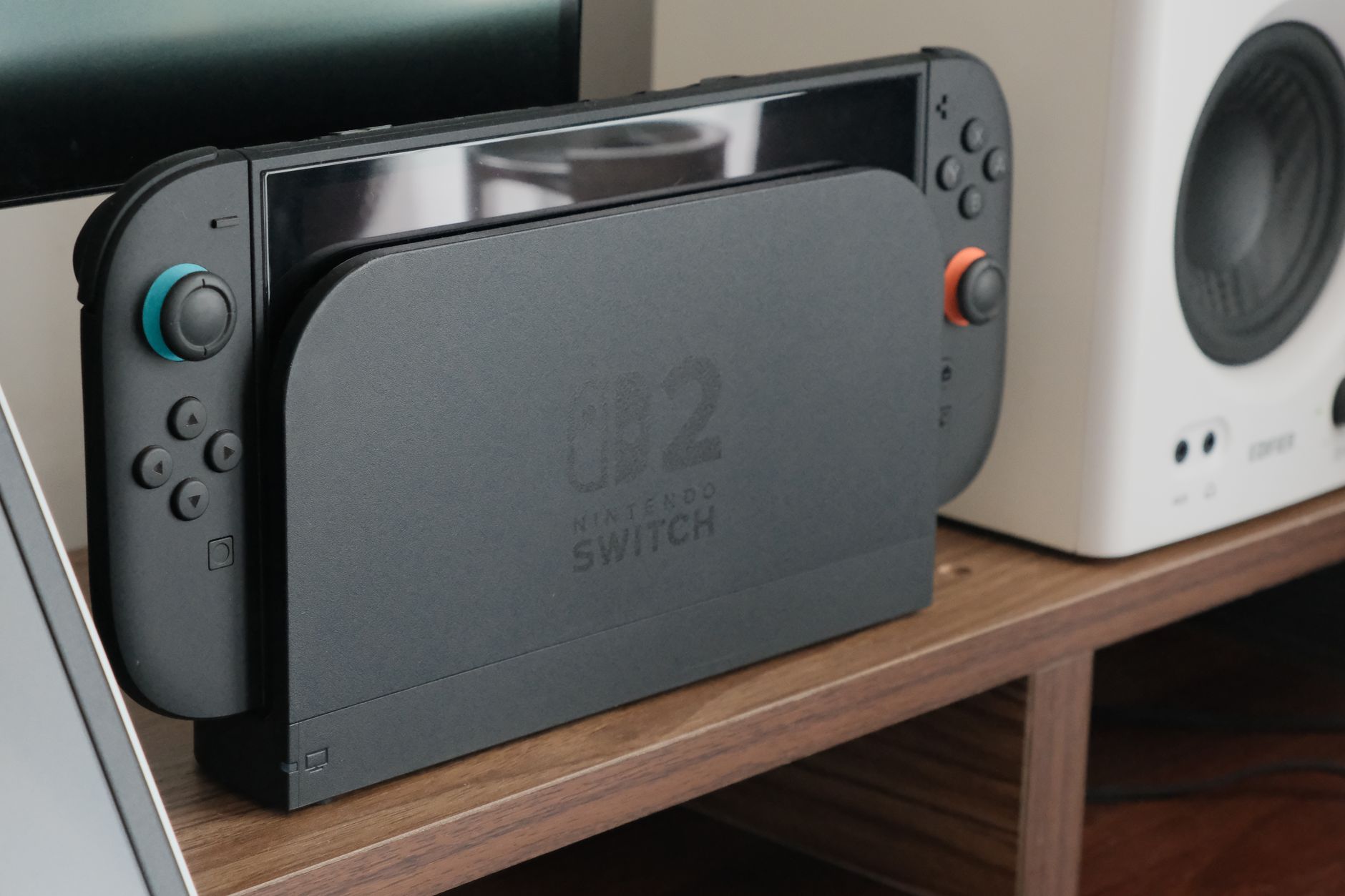 Person playing a Nintendo Switch console, representing modern gaming experience