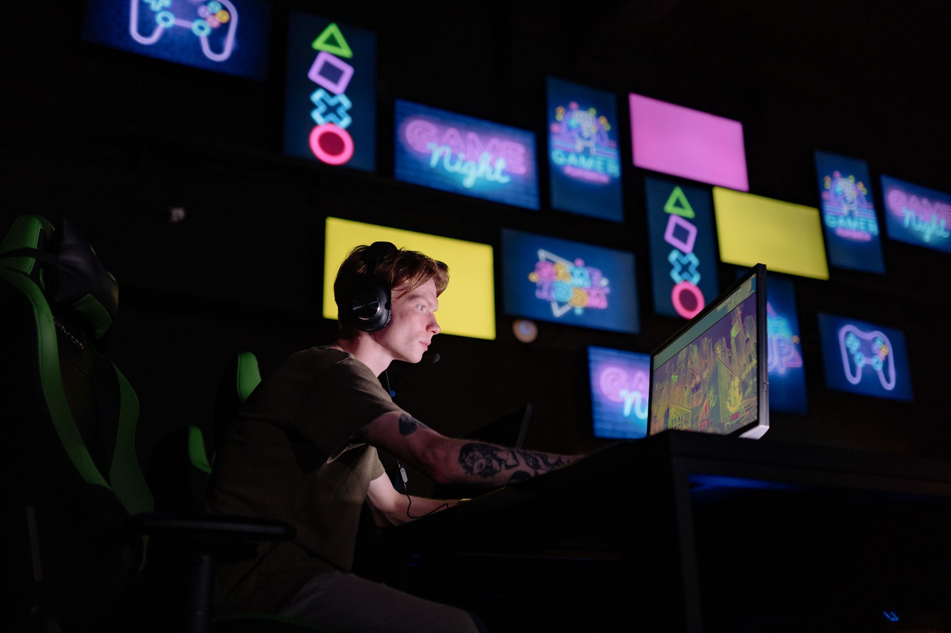 A glowing video game screen in a dark room, capturing the intensity of competitive gaming